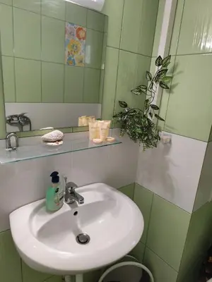 a bathroom with a sink and a mirror at Studio Juli in Lozenets