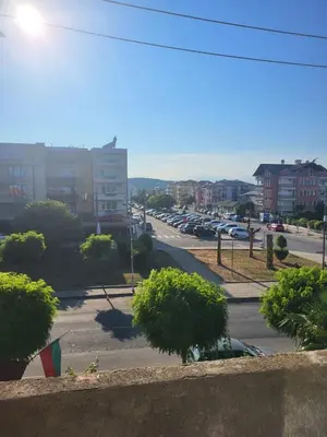 a view of a city street with a parking lot at Апартамент Стоянови in Primorsko