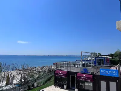 a building with a view of the water at Vega Stevi Vlas - Beachfront in Sveti Vlas