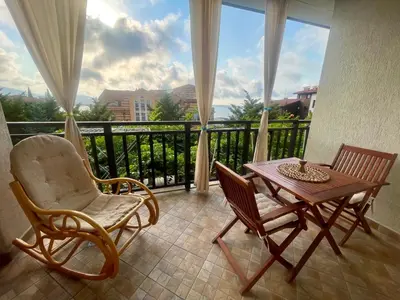 a balcony with a table and chairs and a view at Amarena Studio Santa Marina, Sozopol in Sozopol