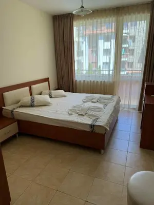 a bedroom with a large bed in front of a window at Ravda14 in Ravda