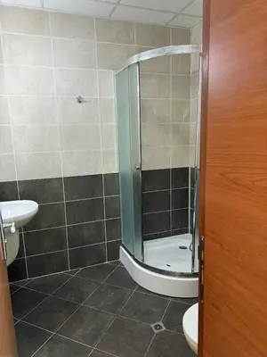 a bathroom with a shower and a toilet and a sink at Ravda14 in Ravda