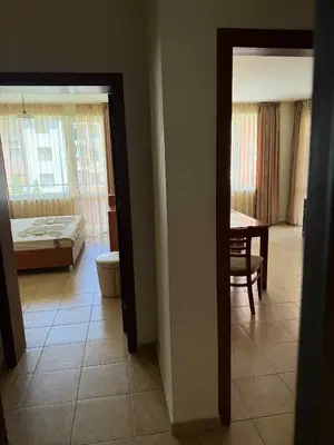 a room with a bedroom and a bed and a table at Ravda14 in Ravda