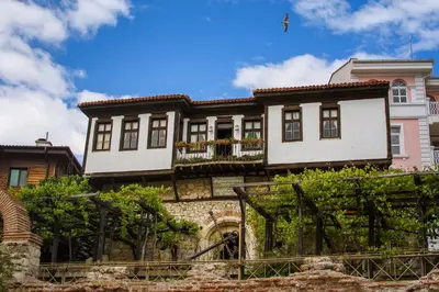 an old house with a fence in front of it at PARADISO B 306 Sea View Apartment Nessebar in Nesebar
