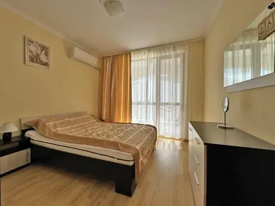 a bedroom with a bed and a large window at 2 rooms Astoria 2 Elenite in Sveti Vlas