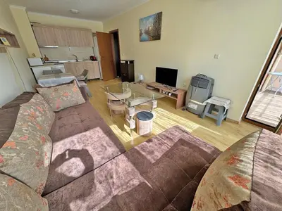 a living room with a couch and a table at 2 rooms Astoria 2 Elenite in Sveti Vlas