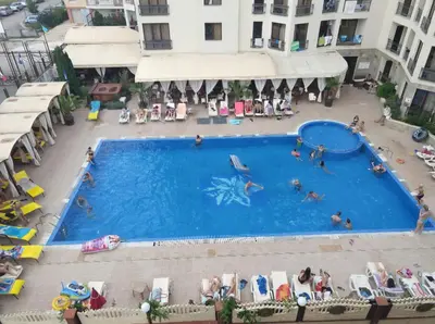 an overhead view of a swimming pool in a hotel at Apartment 15 Sea Grace in Sunny Beach