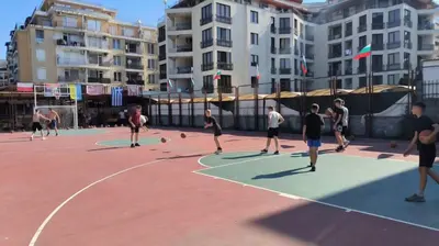 a group of people playing basketball on a basketball court at Apartment 15 Sea Grace in Sunny Beach