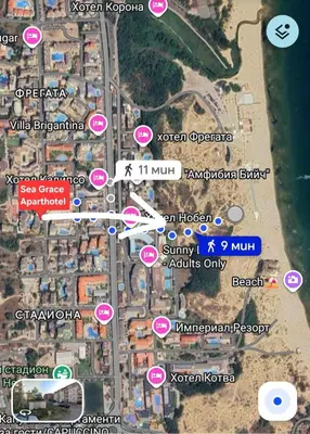 a map of a street with pink signs and buildings at Apartment 15 Sea Grace in Sunny Beach