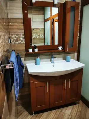 a bathroom with a sink and a mirror at Апартамент Созополски Залез in Sozopol
