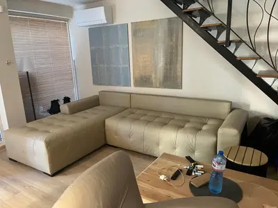 a living room with a couch and a table at Villa Maria in Sveti Vlas