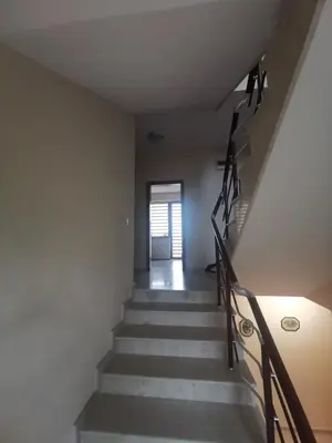 a staircase leading up to a room with a door at Affordable Rooms with BBQ 5 min drive from beach Villa Lusi in Varna City