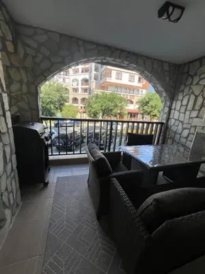 a room with a balcony with a table and chairs at Etara 4 Sweti Wlas Apart Complex in Sveti Vlas