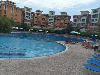 a large swimming pool with buildings in the background at Марина Кеѝп, Ахелой in Aheloy