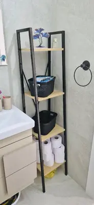 a shelf with baskets and towels on it in a bathroom at JADORE DUNE Apartment 9 Sunny Beach in Sunny Beach