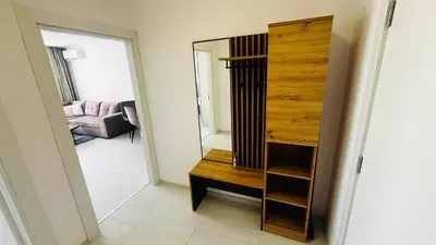 a room with a mirror and a wooden dresser at JADORE DUNE Apartment 10 Sunny Beach in Sunny Beach