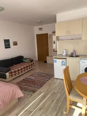 a living room with a couch and a table at Sunny Byala in Byala