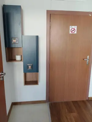 a wooden door with a no smoking sign on it at Sea Studio 22 in Nesebar