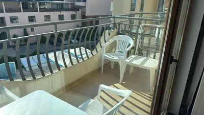 two chairs and a table on a balcony at Jolka in Sunny Beach