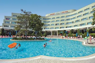 a large swimming pool in front of a hotel at Jeravi Club Hotel - All Inclusive in Primorsko