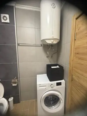 a small bathroom with a washing machine in it at Flat in Cascadas 21 in Sunny Beach