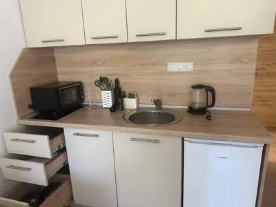 a small kitchen with a sink and a microwave at Flat in Cascadas 21 in Sunny Beach
