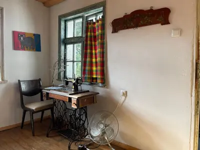 a room with a desk and a window with a fan at Villa Suhodol