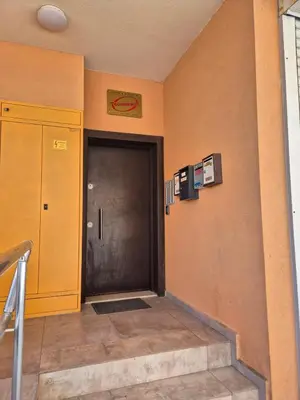 a hallway with a door in a building at Комфортен Апартамент Лазур in Pomorie