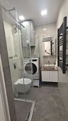 a bathroom with a shower and a toilet and a sink at Vivid Sea and City Luxury Studio 2 plus 2 in Burgas City