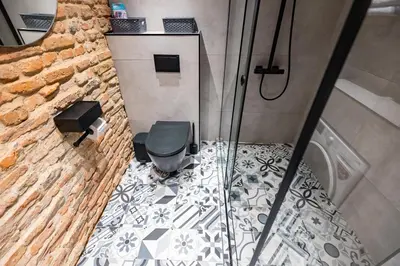 a bathroom with a shower with a toilet in it at Skyler 9 in Varna City
