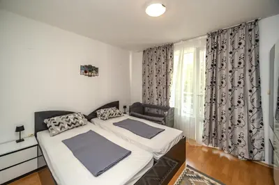 a bedroom with two beds and a window at Apartment E 12 Yassen HV in Sunny Beach