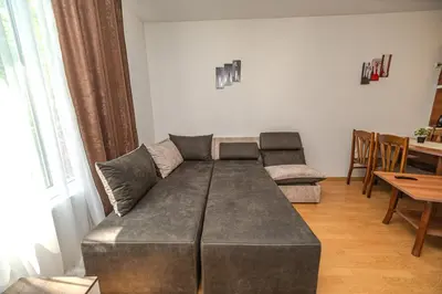 a living room with a couch and a table at Apartment E 12 Yassen HV in Sunny Beach