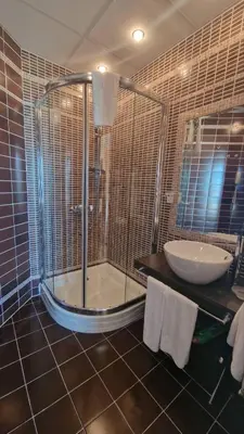 a bathroom with a shower and a sink at Beachfront Apartment Oasis VIP Club in Sunny Beach