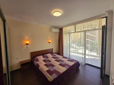 a bedroom with a bed and a large window at Dolche Vita 2, Banana Tree Stay in Sveti Vlas