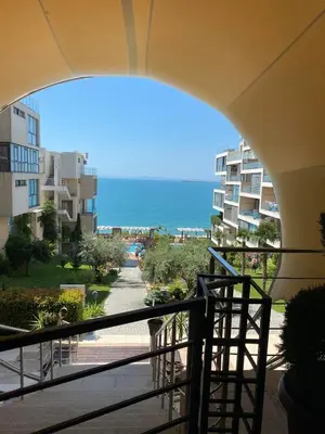 a view of the beach from the balcony of a building at Dolche Vita 2, Banana Tree Stay in Sveti Vlas
