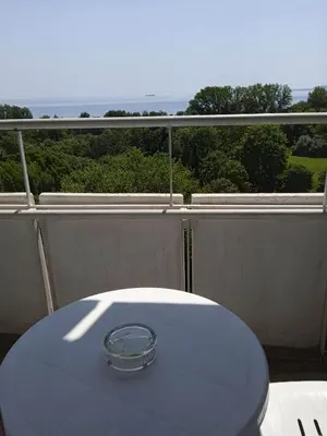 a bowl sitting on top of a table on a balcony at Hotel Park in Burgas City