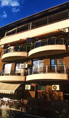 a tall building with balconies on the side of it at DN Kiten in Kiten