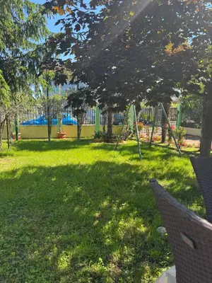 a park with a playground in the grass at Хотел Грация in Lozenets