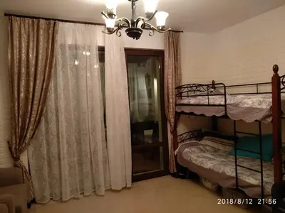 a bedroom with two bunk beds and a window at Элитные апартаменты у моря in Lozenets