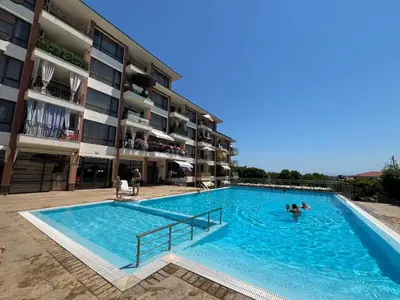 a swimming pool in front of a building at Apartment Sofia Macon Residence Sveti Vlas in Sveti Vlas