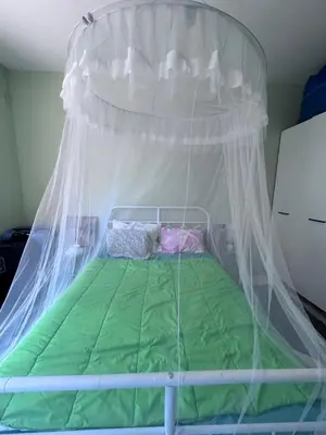 a bed with a canopy in a room at морско бижу in Byala