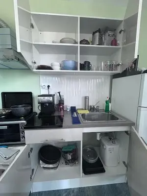 a kitchen with a sink and a counter top at морско бижу in Byala