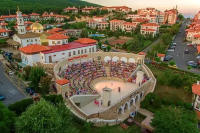 a large crowd of people sitting on a building in a city at Romantic Studio Florence in Sveti Vlas