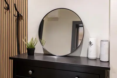 a mirror sitting on top of a dresser at City Center Gem Varna - 5 Guests in Varna City