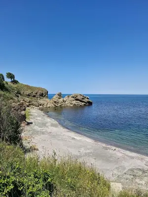 a beach next to the ocean on a clear day at Relax in Tsarevo