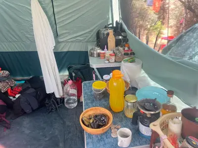 a table in a tent with food and drinks at Палатка на Кара Дере in Byala