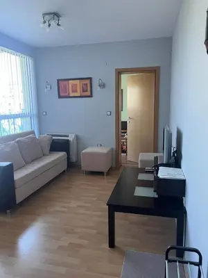 a living room with a couch and a table at 2-bedroom Apartment in Marina Holiday Club Pomorie in Pomorie