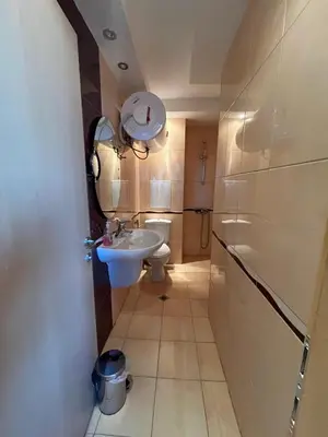 a bathroom with a sink and a toilet at 2-bedroom Apartment in Marina Holiday Club Pomorie in Pomorie