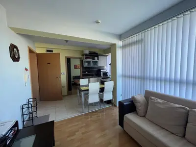 a living room with a couch and a table at 2-bedroom Apartment in Marina Holiday Club Pomorie in Pomorie