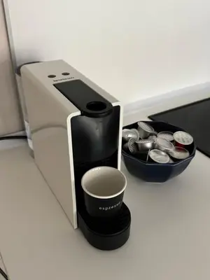 a coffee maker and a cup on a counter at ap Knyaz Boris I in Varna City